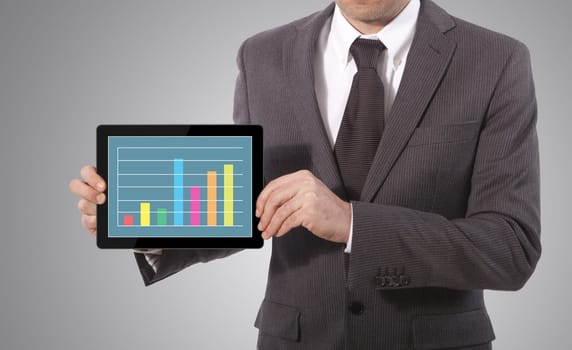business man hand touch screen graph on a tablet