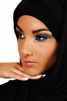 A young beautiful girl with a black headscarf and nice makeup, with her hand under her skin looking away for in closeup over white background.