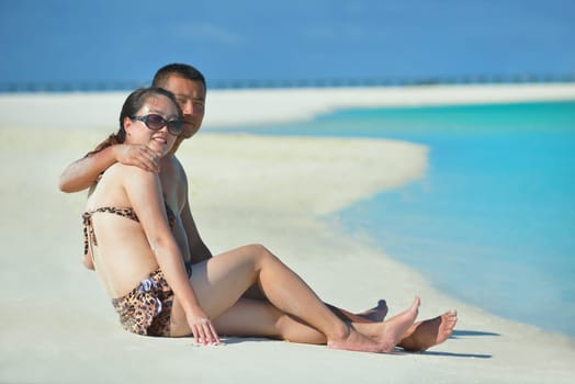 happy young asian couple have fun and romantic time at  summer on beautiful white sand beach