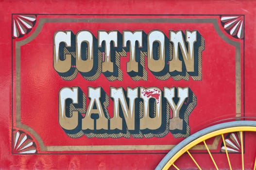 Side view of cotton candy sweets cart, red color, vintage look.
