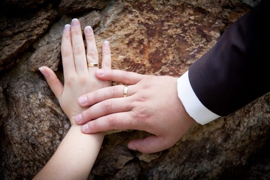 Golden wedding rings on hands of bride