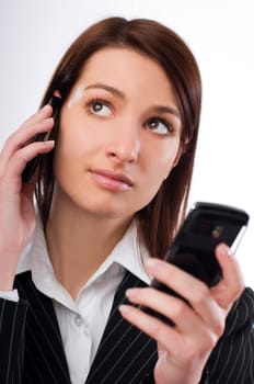 Attractive young woman calling by cellular phone