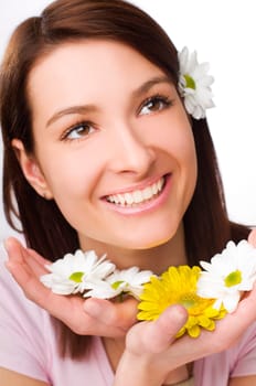 Beautiful young woman with flowers close up
