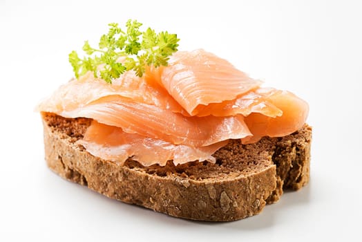 Smoked salmon sandwich on white close up shoot