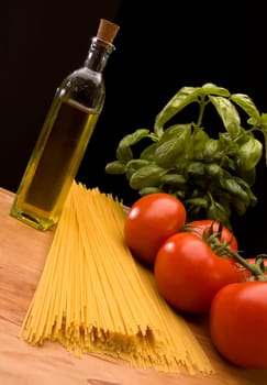 italian pasta with tomatoes basil and oil close up
