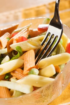 fresh colorful pasta in a bowl close up