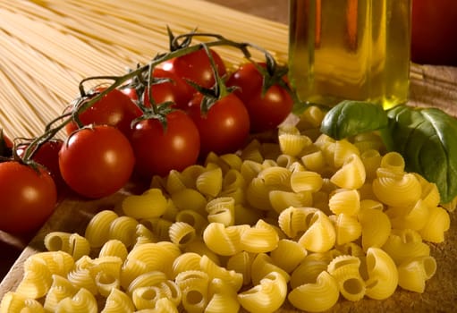 italian pasta with tomatoes basil and oil close up