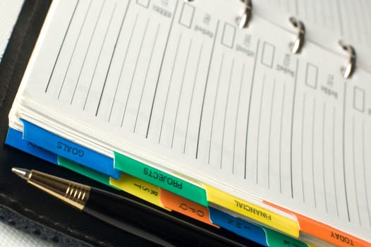 note book with pencil close up shoot