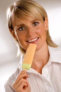young girl eating ice cream close up