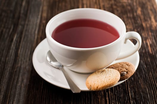 Cup of hot tea with cookies close up shoot