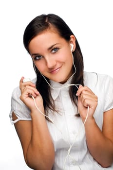 young brunette woman listening music on portable device
