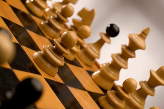 chess game close up with one figure in focus