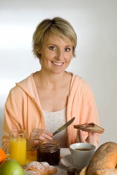 young woman at the table for breakfast