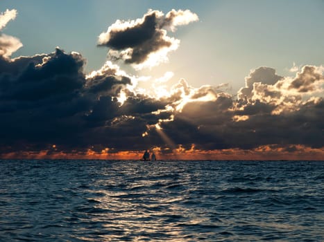 sunset with the boats on a sea