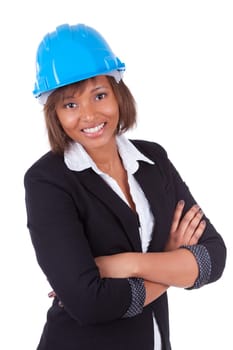 Confident Black African American woman architect smiling with folded arms, isolated on white background