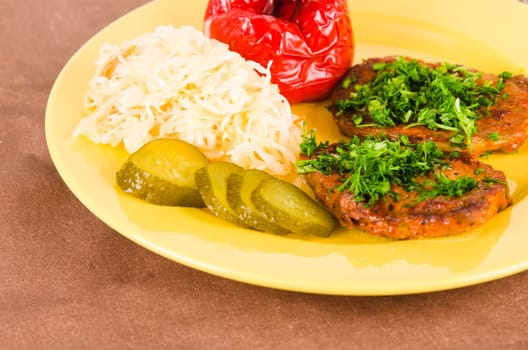Stewed meat with vegetables on a garnish