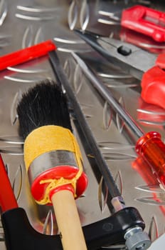 Set of working tools on a metal surface