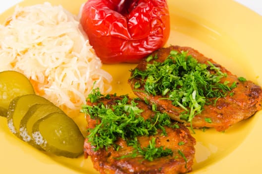 Stewed meat with vegetables on a garnish