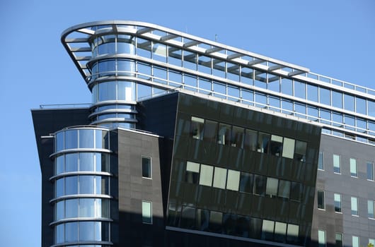 Spree-Eck is a modern building in Berlin (Germany) with blue sky background.