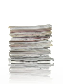 A stack of magazines isolated against a white background