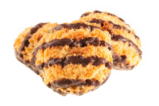 Three coconut macaroons with chocolate isolated on a white background