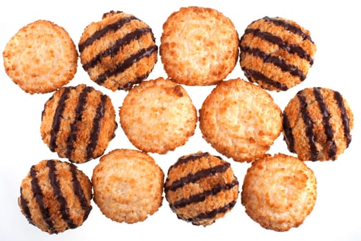 Group of plain and chocolate coconut macaroons on white background