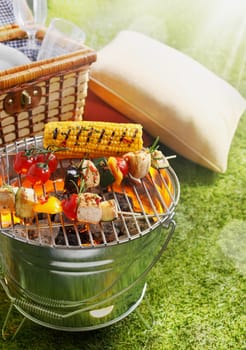 Aerial shot of En brochette and Corn Cob on a grilling pan