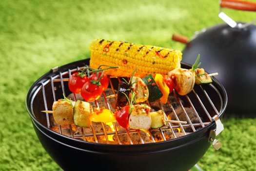 Healthy corncob en brochette on the grill outdoor
