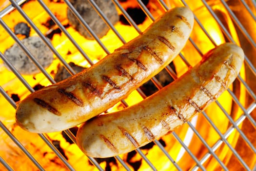 Top view shot of bratwurst on the grilling pan