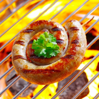 Smoking Flaming Rolled Sausage in a close up shot