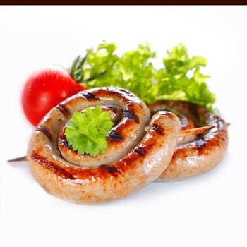 Rolled Italian Sausage on stick in a close up image