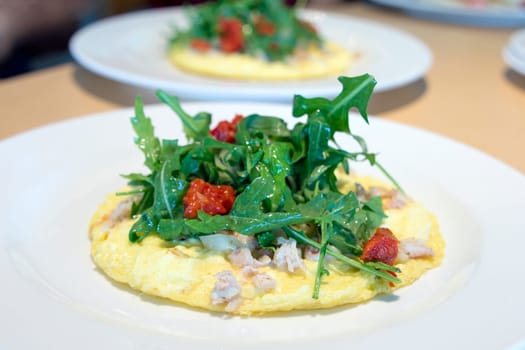 Crab Meat Egg Omelette with Arugula Organic Green Vegetables and Sun Dried Tomatoes