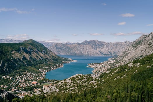 Valley of the Bay of Kotor surrounded by high mountains in bright sunlight. Montenegro. High quality photo
