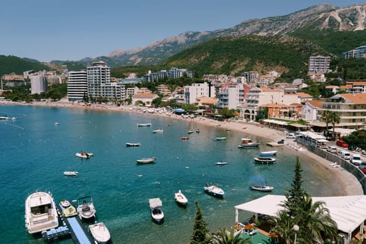 Motor boats are moored off the coast of the new part of Budva. Montenegro. High quality photo