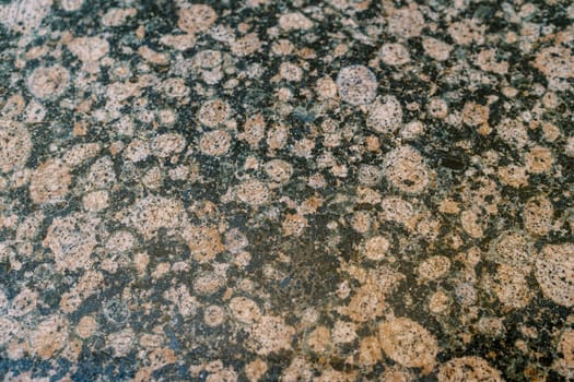 Abstract texture of granite with round splashes. High quality photo