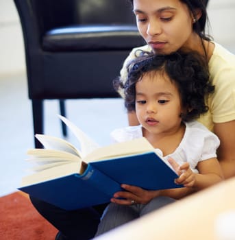 Mother, child and book reading in home for storytelling, childhood development or education learning. Little girl, woman and knowledge talk or information growth, fantasy imagine or bonding together.