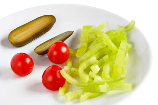 Detail of the vegetable plate - tomatoes, pepper and pickled gherkins