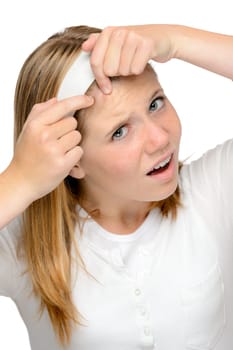 Teenager girl squeezing pimple skin problems spot cleaning face