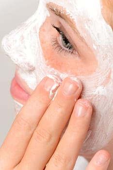 Applying mask fingers young girl beauty treatment skin purity