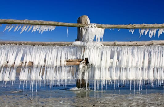 Icicles on a wooden fence at the Baltic Sea,Western Pomerania Lagoon Landscape National Park,Mecklenburg-Western Pomerania,Germany