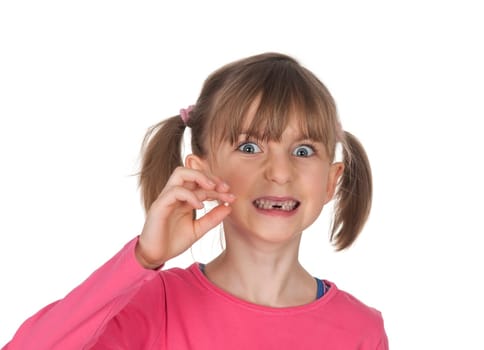 Girl shows baby tooth