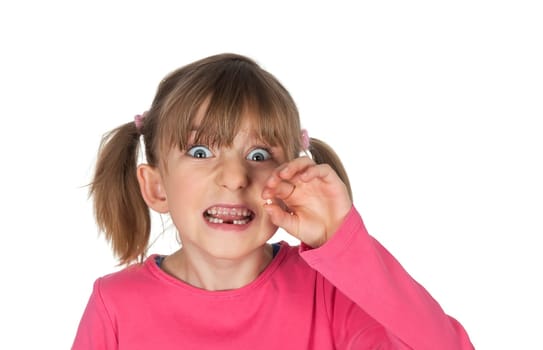 Girl shows baby tooth