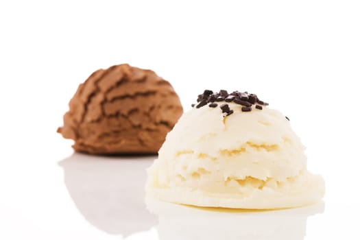 Vanilla ice cream with chocolate chips and chocolate ice cream against white background