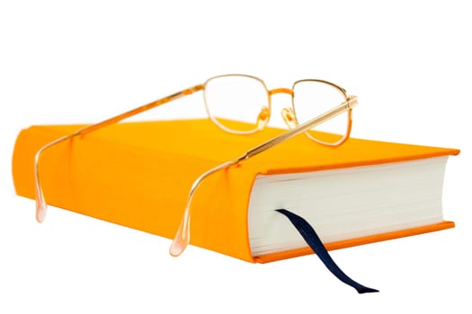 photo of the orange book with glasses isolated on white background