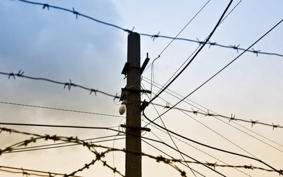photo of old rusty barbed wire against sky