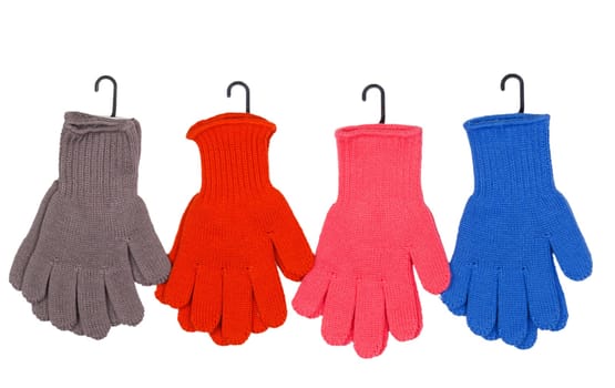 Four pairs of colorful gloves on a white background