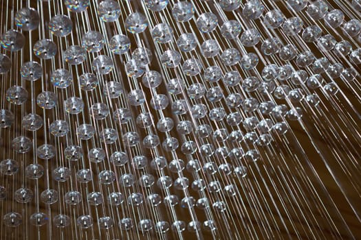 abstract strings and crystals arranged in geometric pattern.