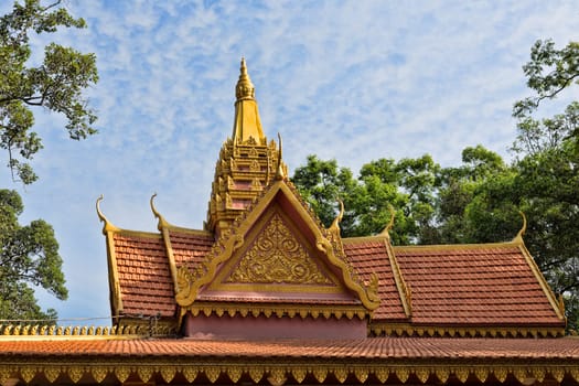 Oriental temple decorated with a golden roof in Siem Reap, Cambodia