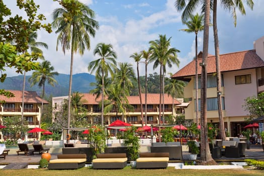 tropical hotel c palms against the blue sky