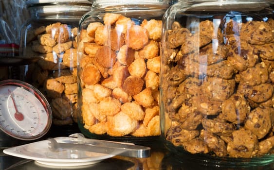 Fresh cookies in jars next to the board weights